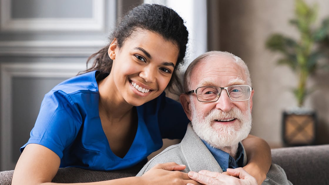 Smiling Man with Home Care Aide